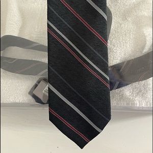New condition mens vintage Creighton striped tie. Matte finish.